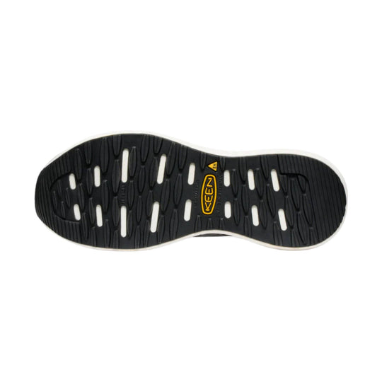Black rubber shoe outsole with yellow KEEN logo and oval traction lugs, shown from below