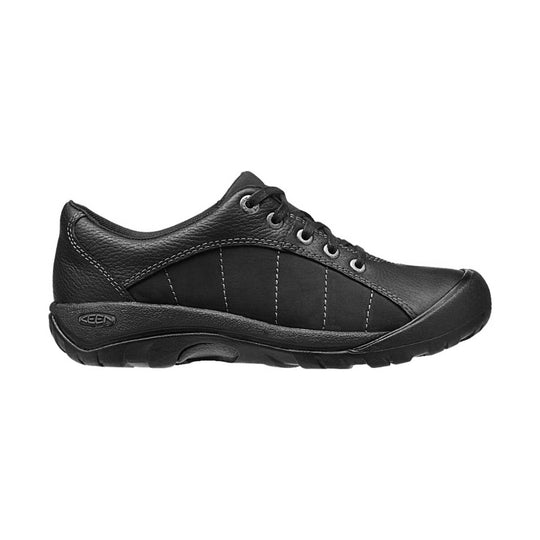 Black low-top lace-up walking shoe with textured leather and rubber toe cap, side view