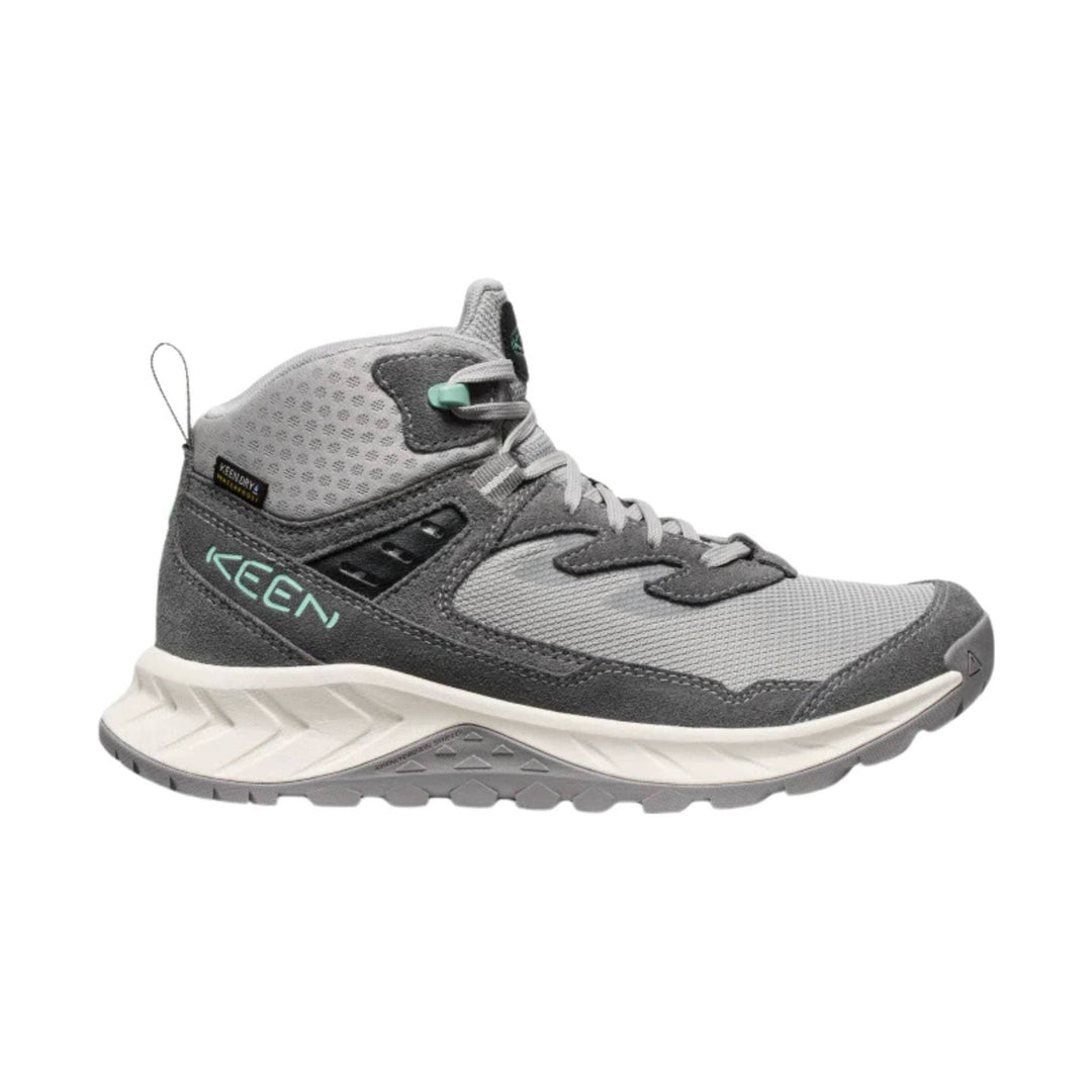 Gray mid-top hiking boot with mesh panels, dark suede overlays, and a thick white and gray lug sole