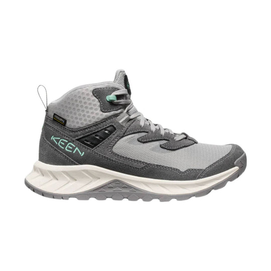 Gray mid-top hiking boot with mesh panels, dark suede overlays, and a thick white and gray lug sole