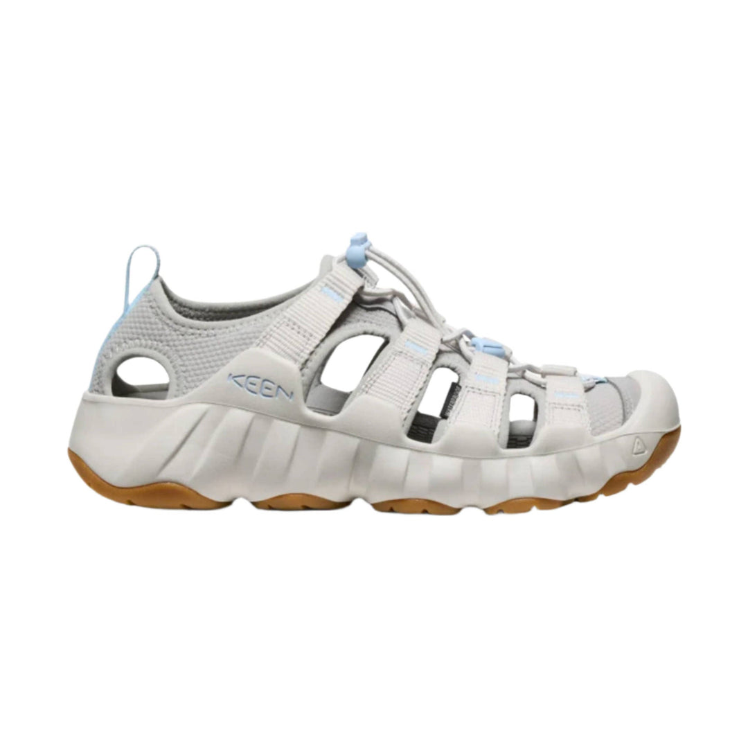 Light gray closed-toe sandal with cutout sides, bungee laces, and gum sole