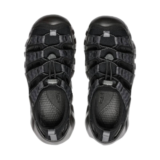 Black closed-toe hiking sandals with bungee laces, side cutouts, and thick rubber soles, shown top down.