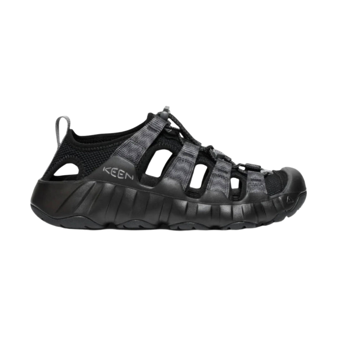 Black closed-toe hiking sandal with cutout sides, bungee laces, and a heel pull tab