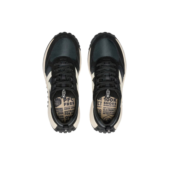 Black and cream low-top sneakers with mesh panels, black laces, and printed insoles