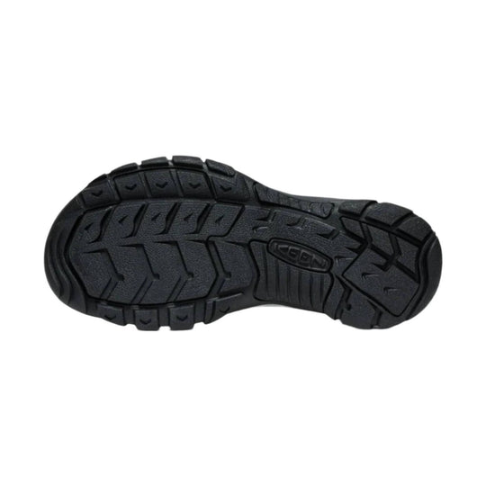 Black rugged shoe outsole with deep traction lugs and KEEN logo