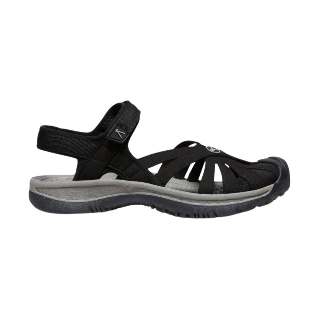 Black strappy hiking sandal with heel strap and gray cushioned sole