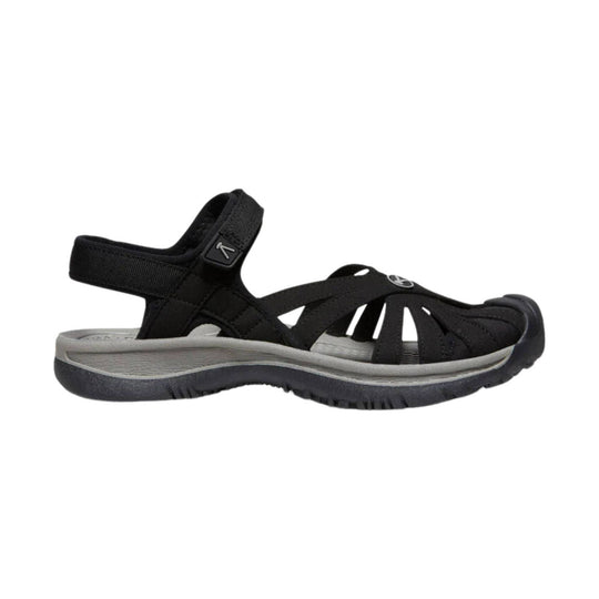 Black strappy hiking sandal with heel strap and gray cushioned sole