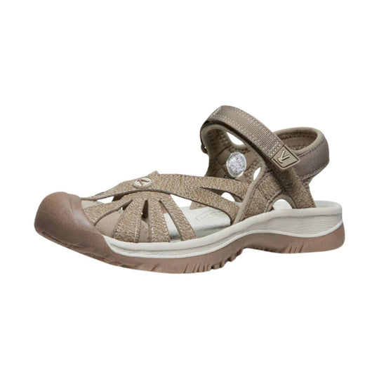 Tan and taupe closed-toe hiking sandal with adjustable straps and a white cushioned sole
