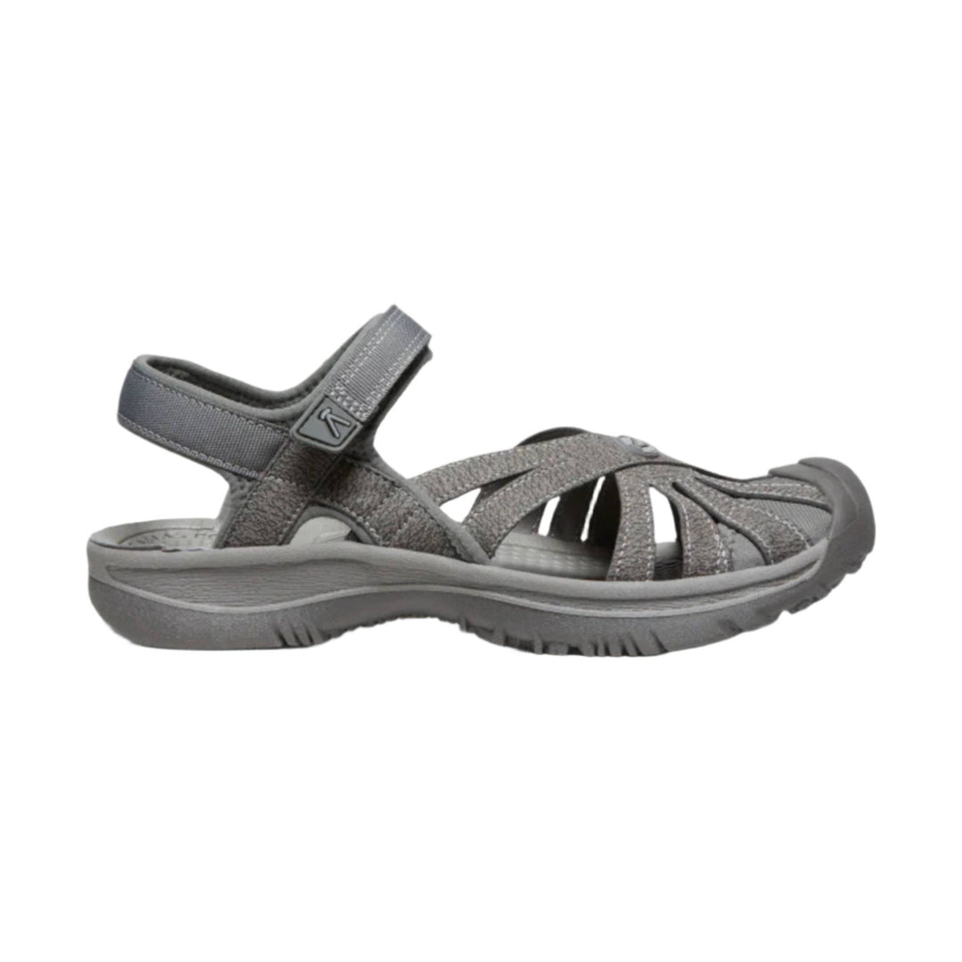 Gray closed-toe walking sandal with crisscross straps, heel strap, and thick rubber sole