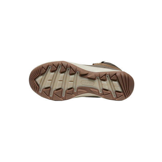 Brown and beige boot sole with rugged tread