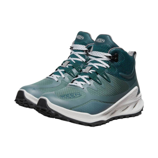 Teal and gray hiking boots with white laces and black soles, shown in a side view