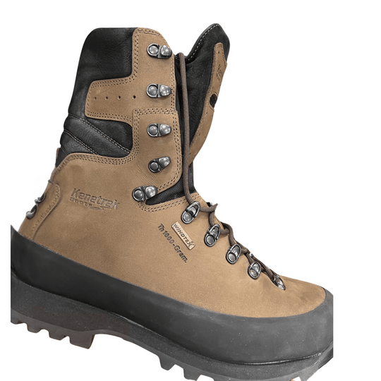 Tan and black lace-up hiking boot with side zipper, metal eyelets, and lug sole
