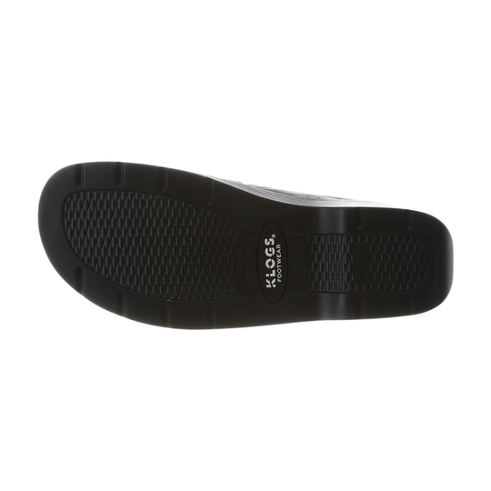 Black rubber shoe outsole with textured tread and KLOGS FOOTWEAR branding