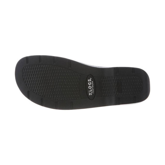 Black shoe sole with textured tread and Klogs Footwear logo