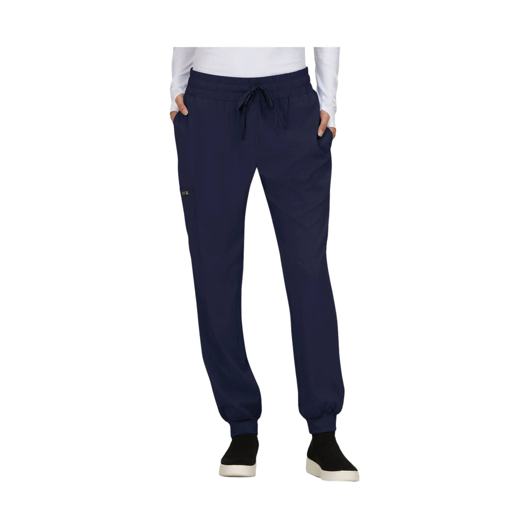Navy jogger pants with elastic waistband, drawstring, side pockets, and cuffed ankles