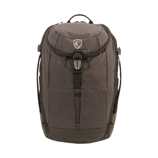 Brown backpack with a front flap buckle closure, top handle, and side compression straps