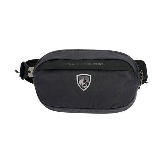 Black sling pack with front zipper pocket, shield logo, and shoulder strap