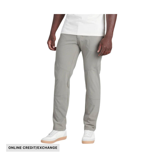 Light gray men’s pants with articulated seams and white sneakers, shown on a model