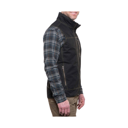 Black zip-front vest over a blue plaid long-sleeve shirt, shown in side view