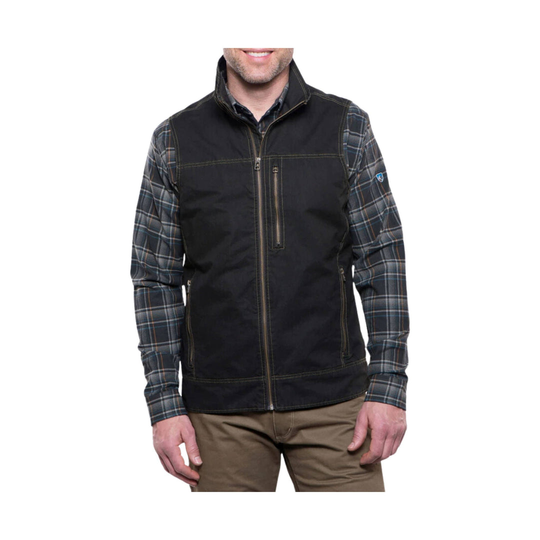 Black zip-front vest over a plaid long-sleeve shirt, shown on a model from the shoulders to mid-thigh