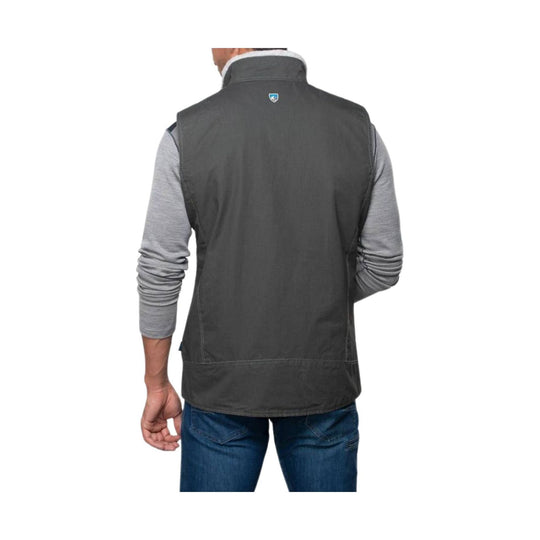 Charcoal quilted vest worn over a light gray long-sleeve shirt, shown from the back