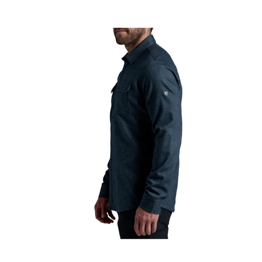Dark blue long-sleeve button-up shirt with chest pocket, shown in side profile