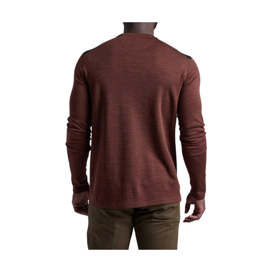 Rust-colored long-sleeve crewneck shirt shown from the back