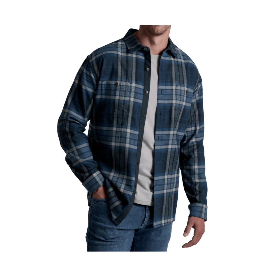 Blue and gray plaid long-sleeve button-up shirt worn over a white T-shirt