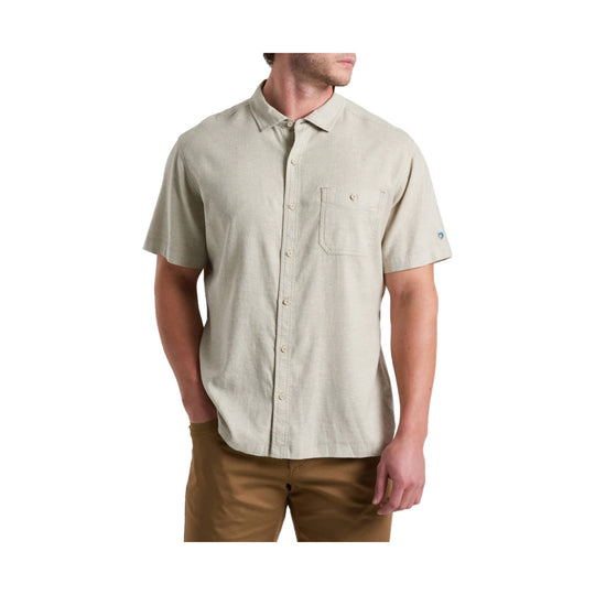 Light beige short-sleeve button-up shirt with chest pocket on a male model