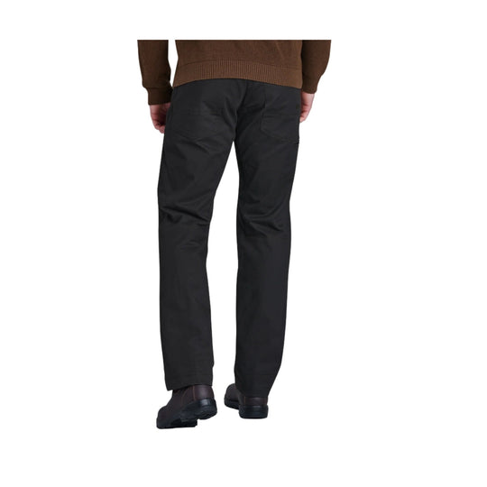Rear view of black men’s pants with a straight leg fit and back pockets