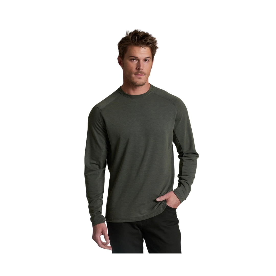 Long-sleeve dark olive crewneck shirt worn with black pants