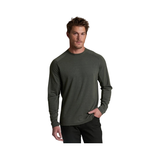 Long-sleeve dark olive crewneck shirt worn with black pants