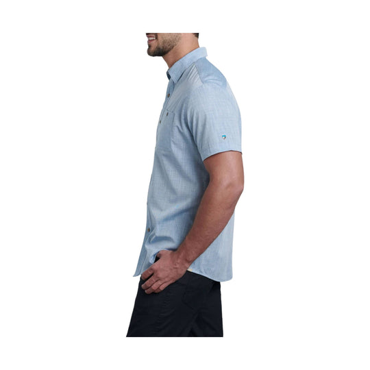 Light blue short-sleeve button-up shirt with a chest pocket, shown in side profile on a model