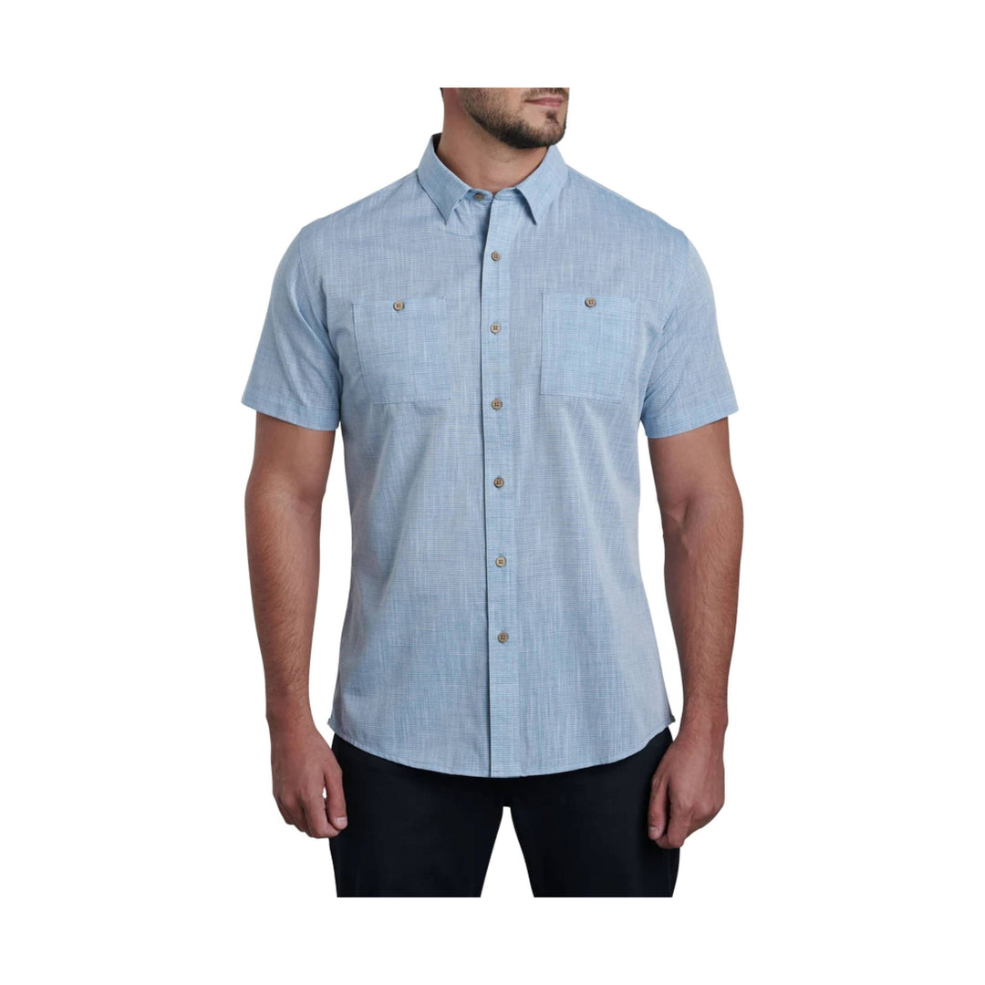 Light blue short-sleeve button-up shirt with chest pockets and a collared neckline