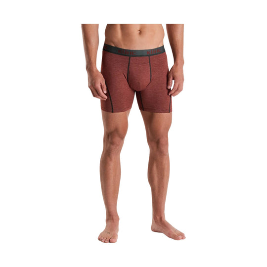 Rust-colored boxer briefs with black seam details and branded waistband