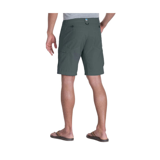 Gray cargo shorts shown from the back on a model, with side pockets and a small logo patch at the waistband.