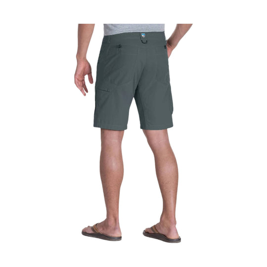 Gray cargo shorts shown from the back on a model