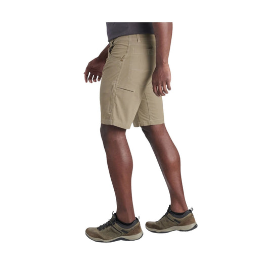 Khaki cargo shorts with front and side pockets, shown on a model with hiking shoes
