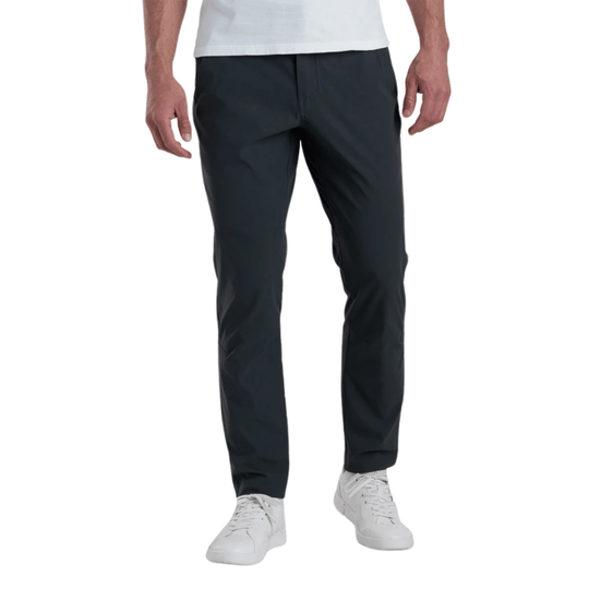 Dark charcoal men’s athletic pants with tapered legs, shown with white sneakers