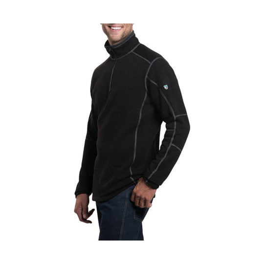 Man wearing a black turtleneck sweater on a white background