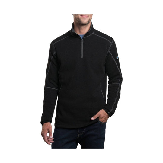 Man wearing a black quarter-zip pullover on a white background