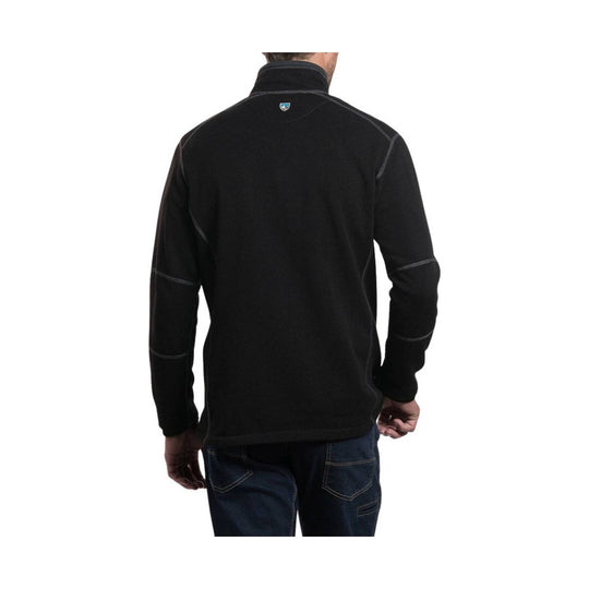 Person wearing a black quarter-zip sweatshirt on a white background