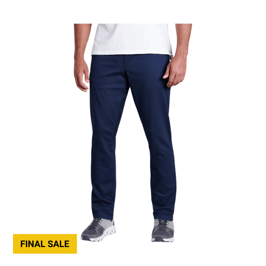 Navy tapered jeans on a model with a yellow FINAL SALE label