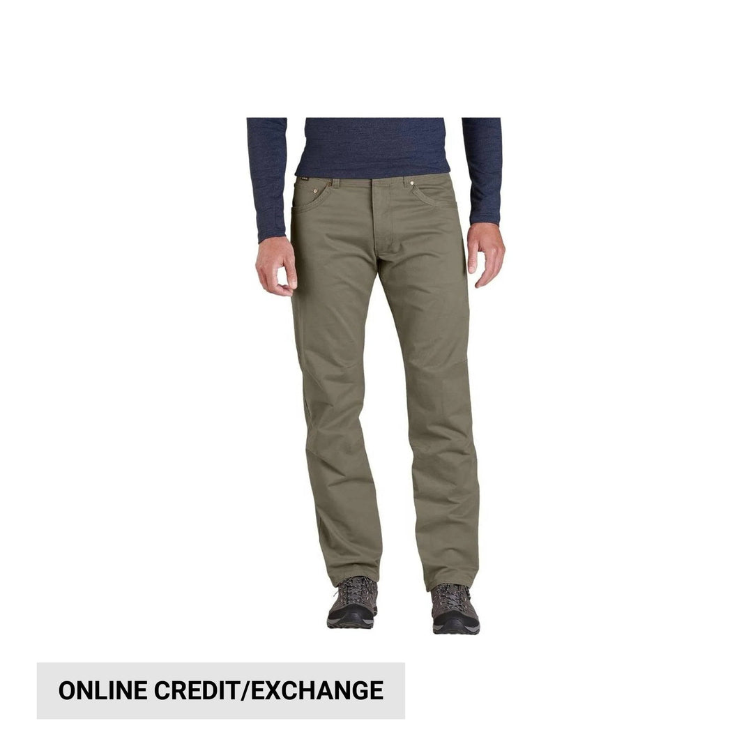 Olive straight-leg pants with front pockets and hiking shoes, shown on a model