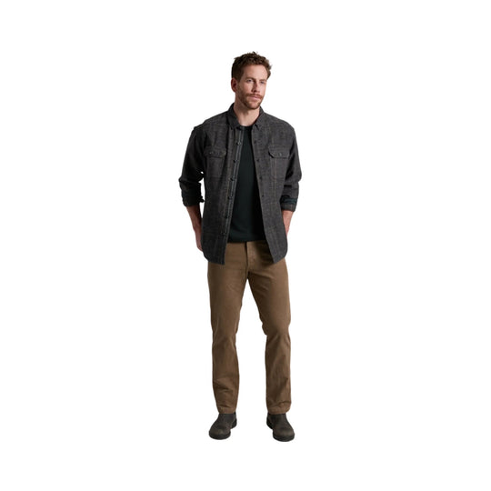 Charcoal button-up overshirt worn over a dark tee with tan pants and dark slip-on shoes