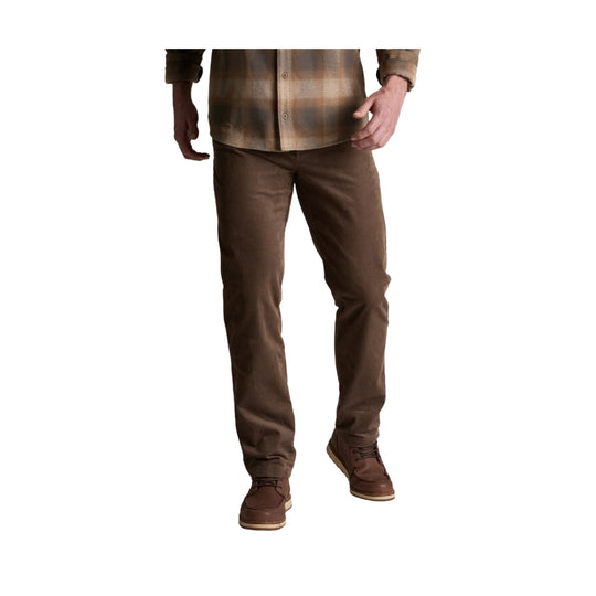 Brown corduroy pants shown on a model with a straight-leg fit