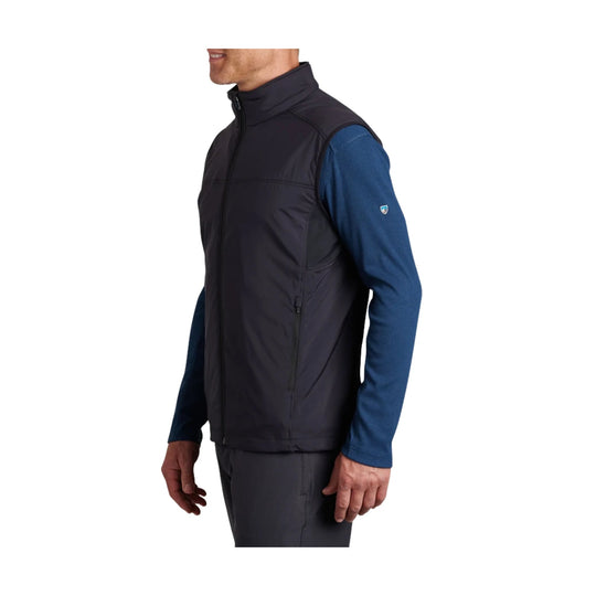 Dark zip-front men’s vest shown on a side-view model over a blue long-sleeve shirt