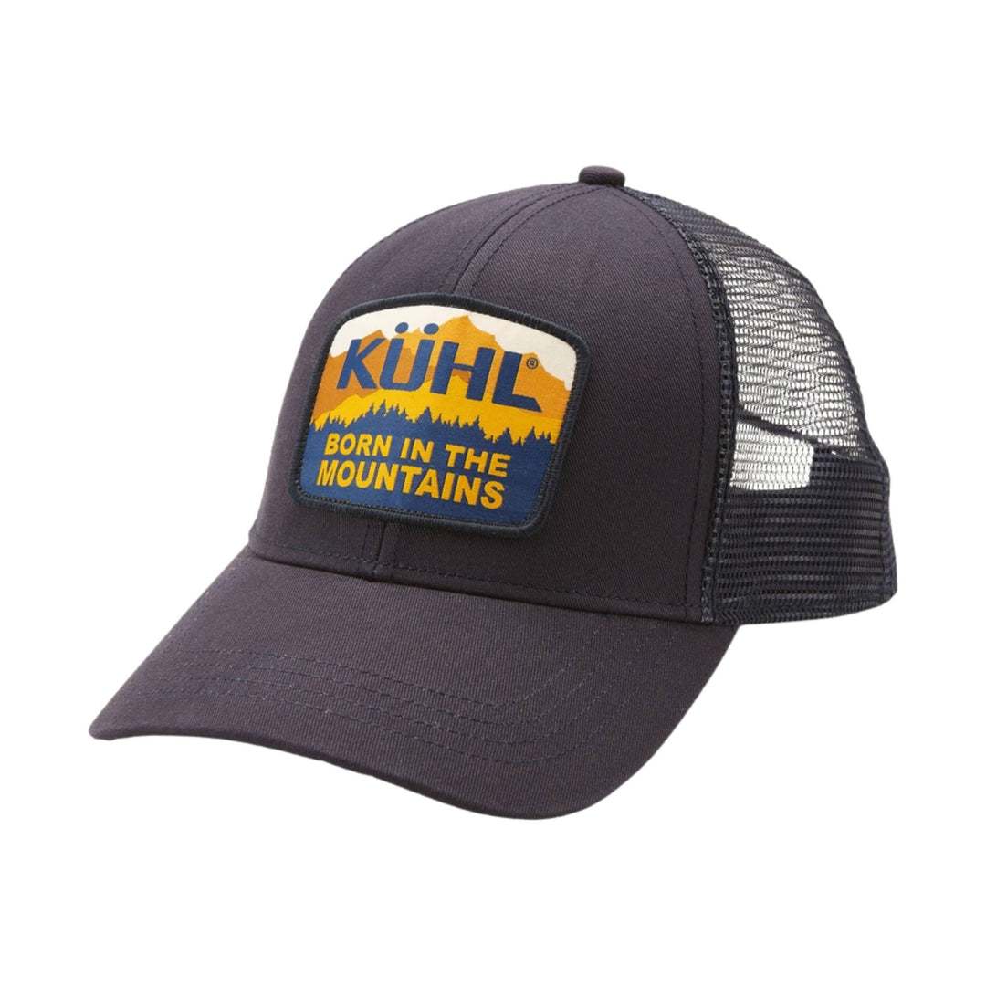 Dark trucker hat with mesh back and a front patch reading KÜHL BORN IN THE MOUNTAINS