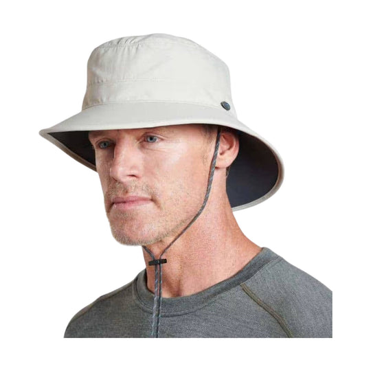 Light gray wide-brim sun hat with chin cord, worn by a model
