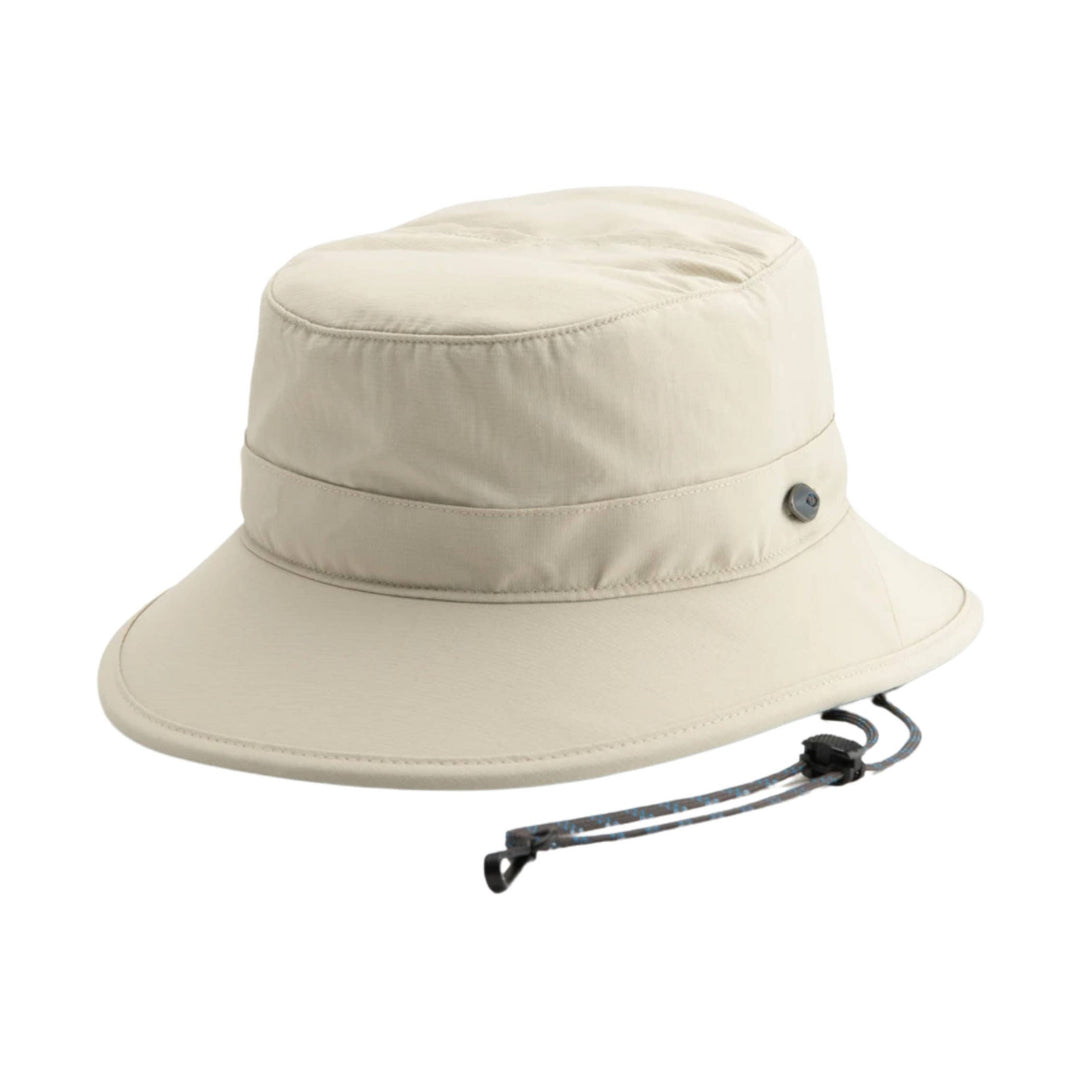 Beige bucket hat with a wide brim and adjustable chin cord